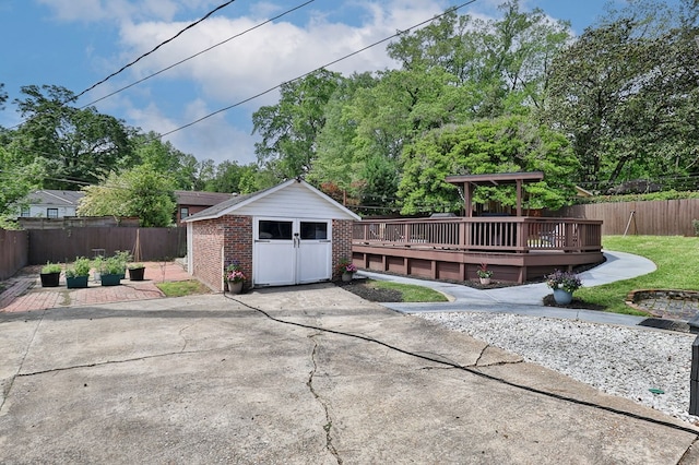 exterior space with an outbuilding and a fenced backyard
