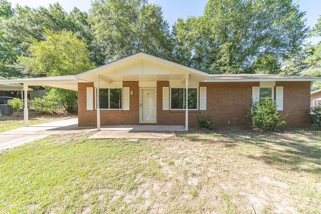 single story home with a carport and a front lawn