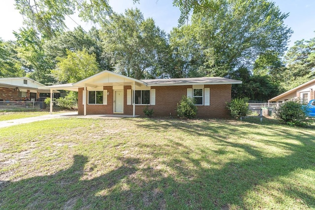 ranch-style house featuring a front yard, a porch, and a carport