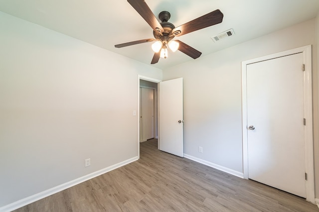 unfurnished bedroom featuring light hardwood / wood-style flooring and ceiling fan