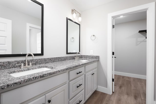 bathroom featuring vanity and hardwood / wood-style floors