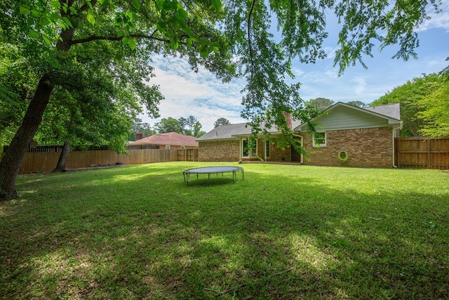 view of yard with a trampoline