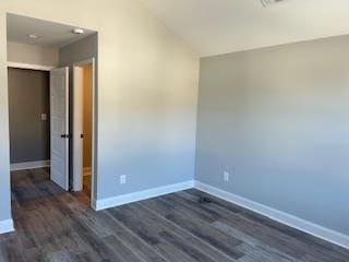 unfurnished room featuring dark hardwood / wood-style flooring