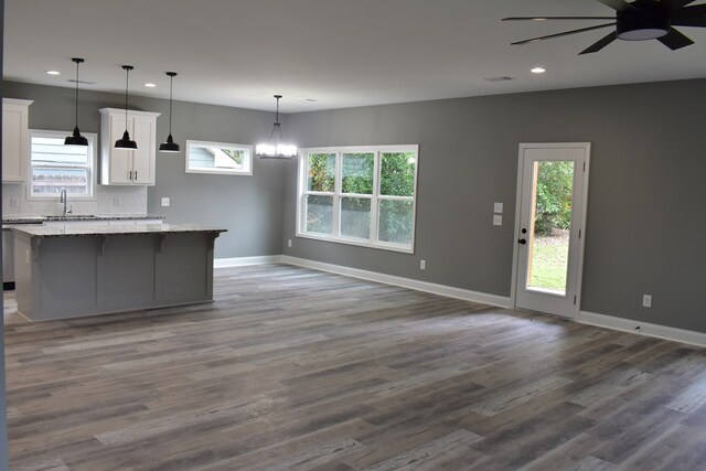 kitchen featuring dark hardwood / wood-style floors, white cabinetry, and a wealth of natural light