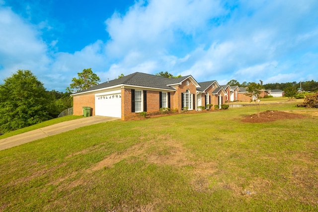view of front of home featuring brick siding, a garage, driveway, and a front yard