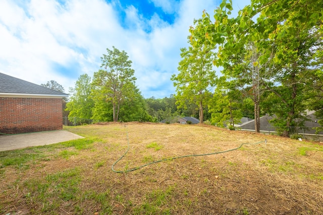 view of yard with fence and a patio area