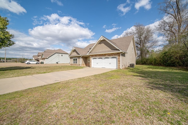 view of front of house with driveway, central AC, a front lawn, a garage, and stone siding