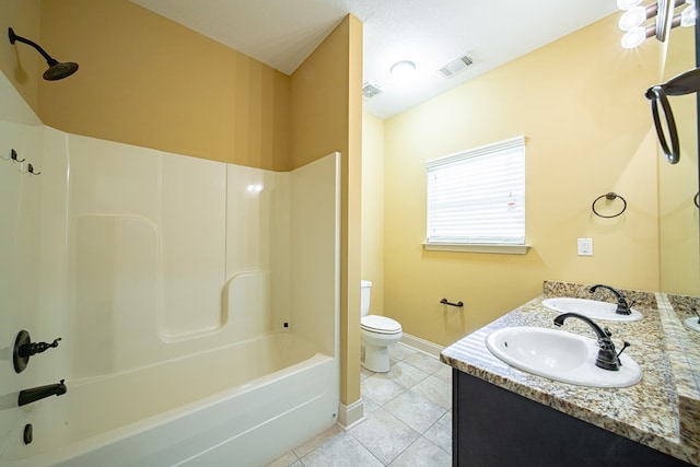 bathroom featuring a sink, visible vents, toilet, and tile patterned flooring