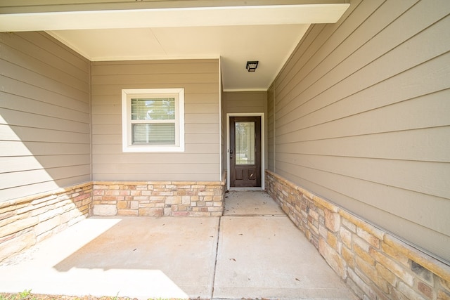 property entrance with a patio