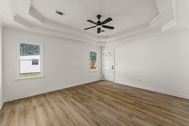 5437 Chatham Woods Ct, Columbus, GA 31907 - spare room with a tray ceiling, ornamental molding, healthy amount of natural light, wood finished floors, and a ceiling fan