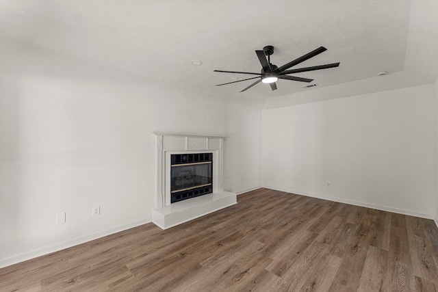 5437 Chatham Woods Ct, Columbus, GA 31907 - unfurnished living room featuring ceiling fan, wood finished floors, and a tile fireplace