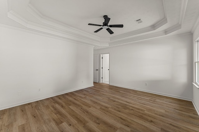 5437 Chatham Woods Ct, Columbus, GA 31907 - spare room with a raised ceiling, crown molding, wood finished floors, and a ceiling fan