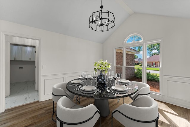 5437 Chatham Woods Ct, Columbus, GA 31907 - dining area featuring a chandelier, a wainscoted wall, dark wood finished floors, and high vaulted ceiling