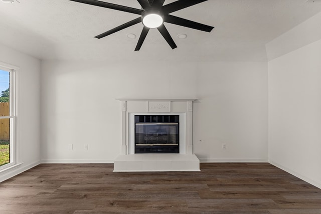 5437 Chatham Woods Ct, Columbus, GA 31907 - unfurnished living room with plenty of natural light, a glass covered fireplace, wood finished floors, and a ceiling fan