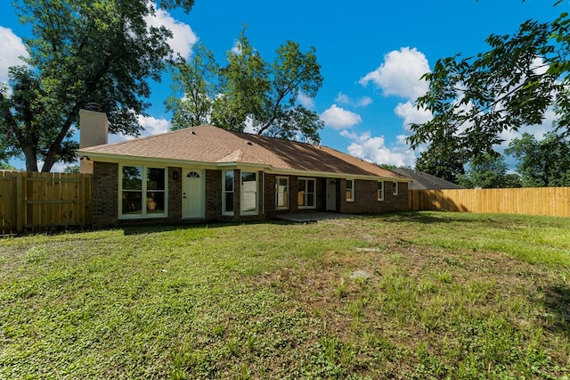 5437 Chatham Woods Ct, Columbus, GA 31907 - back of house with a chimney, a fenced backyard, and brick siding