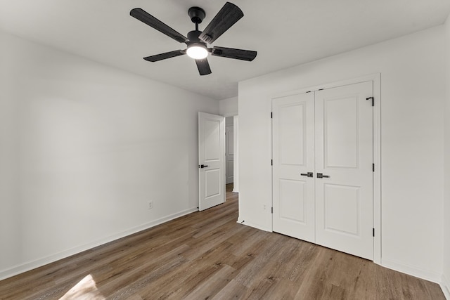 5437 Chatham Woods Ct, Columbus, GA 31907 - unfurnished bedroom featuring wood finished floors, a closet, and a ceiling fan