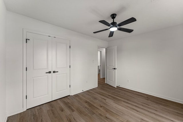 5437 Chatham Woods Ct, Columbus, GA 31907 - unfurnished bedroom featuring wood finished floors, a closet, and a ceiling fan