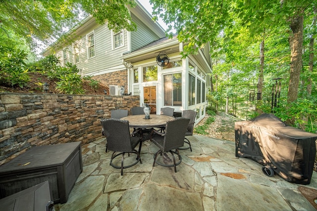 view of patio featuring a sunroom and grilling area