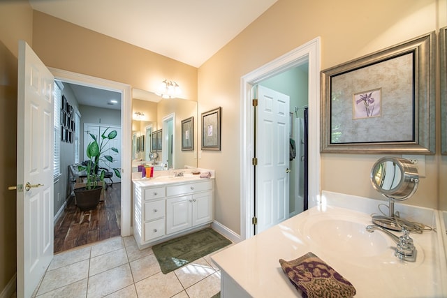 bathroom with vanity and tile patterned floors