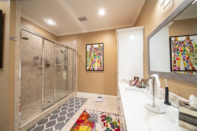 bathroom featuring tile patterned flooring, vanity, a shower with door, and crown molding