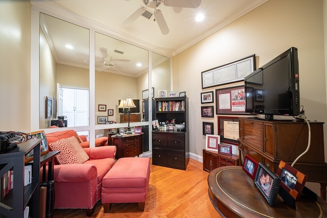 interior space featuring ornamental molding, ceiling fan, and light hardwood / wood-style floors