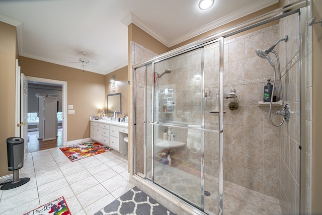 bathroom with vanity, an enclosed shower, tile patterned flooring, and crown molding