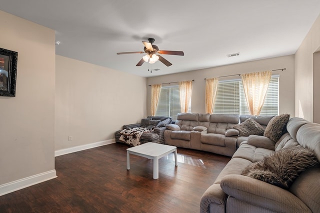 living room with ceiling fan, dark hardwood / wood-style floors, and a healthy amount of sunlight