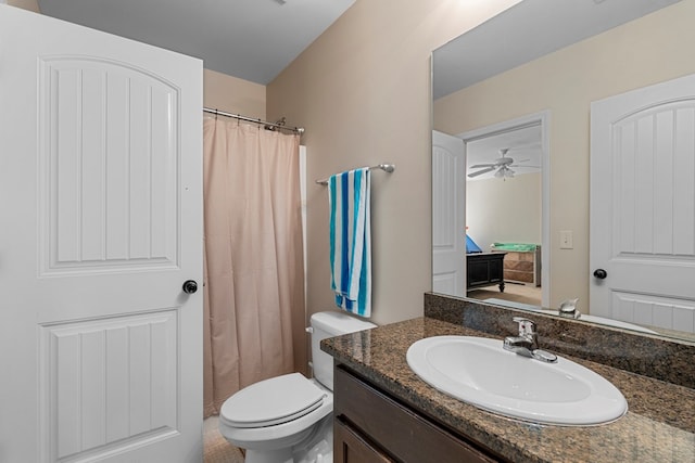 bathroom with a shower with curtain, vanity, and toilet