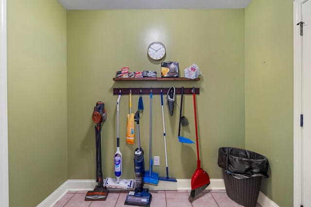 exercise room with light tile patterned floors