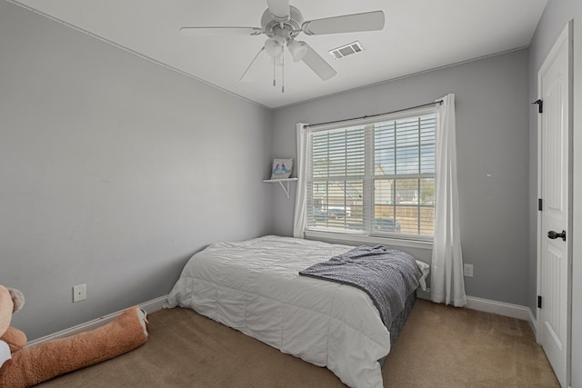 bedroom with light colored carpet and ceiling fan