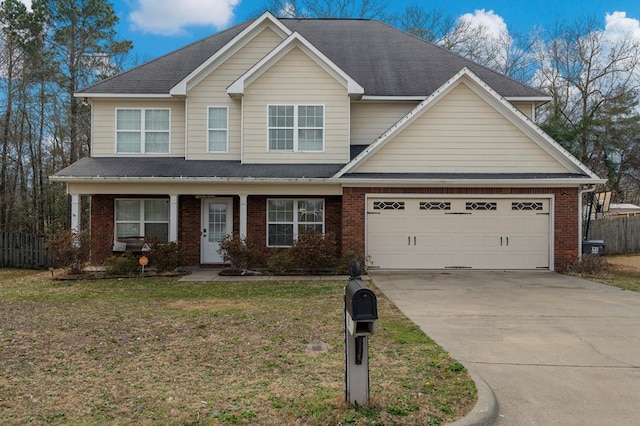 view of front of home featuring a garage and a front lawn