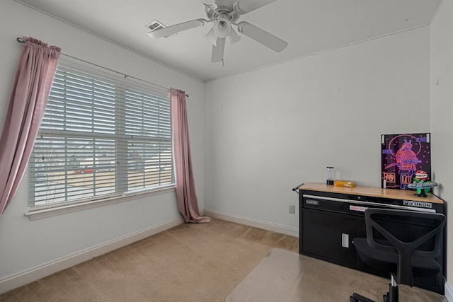 home office with ceiling fan and light carpet