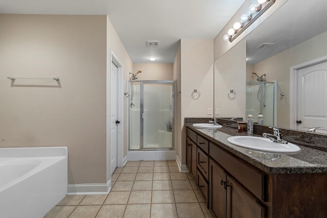 bathroom with independent shower and bath, vanity, and tile patterned floors