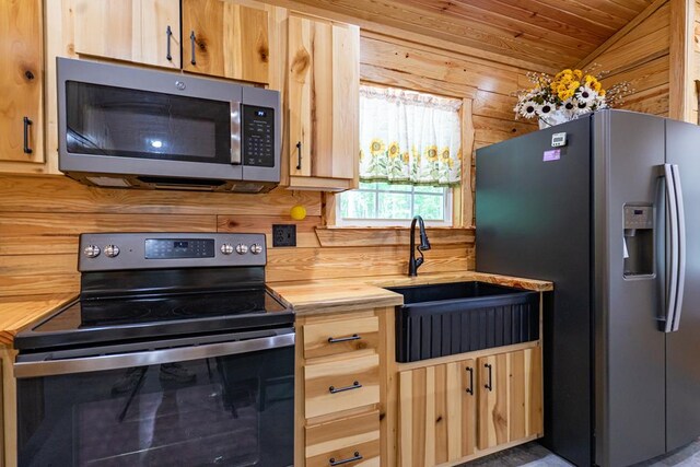 153 N Whatley Rd, Lagrange, GA 30240 - kitchen with appliances with stainless steel finishes, butcher block counters, light brown cabinets, a sink, and wooden ceiling