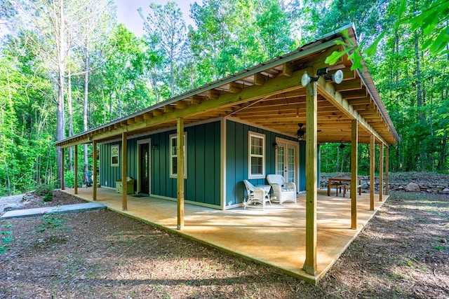 153 N Whatley Rd, Lagrange, GA 30240 - rear view of house featuring board and batten siding, french doors, and a patio area