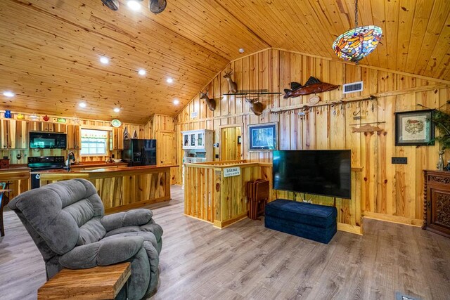 153 N Whatley Rd, Lagrange, GA 30240 - living room featuring wood ceiling, wood walls, high vaulted ceiling, wood finished floors, and baseboards