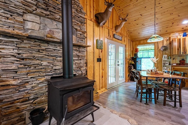153 N Whatley Rd, Lagrange, GA 30240 - dining space with a wood stove, wood finished floors, wooden walls, and lofted ceiling