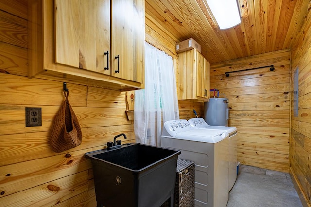 153 N Whatley Rd, Lagrange, GA 30240 - laundry area featuring cabinet space, wooden walls, electric water heater, washing machine and clothes dryer, and wooden ceiling