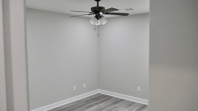 2830 N Lumpkin Rd, Columbus, GA 31903 - spare room featuring wood finished floors, a ceiling fan, and baseboards