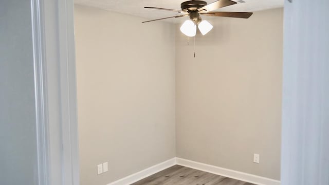 2830 N Lumpkin Rd, Columbus, GA 31903 - empty room with wood finished floors, ceiling fan, and baseboards