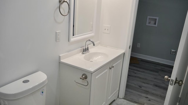 2830 N Lumpkin Rd, Columbus, GA 31903 - bathroom featuring vanity, toilet, and wood finished floors