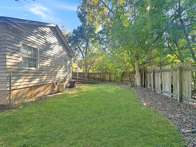 view of yard featuring central air condition unit