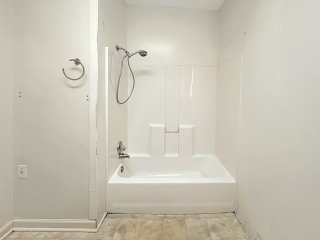 bathroom with shower / tub combination