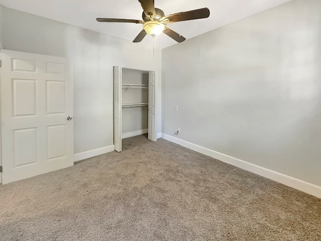 unfurnished bedroom featuring carpet floors, a closet, and ceiling fan