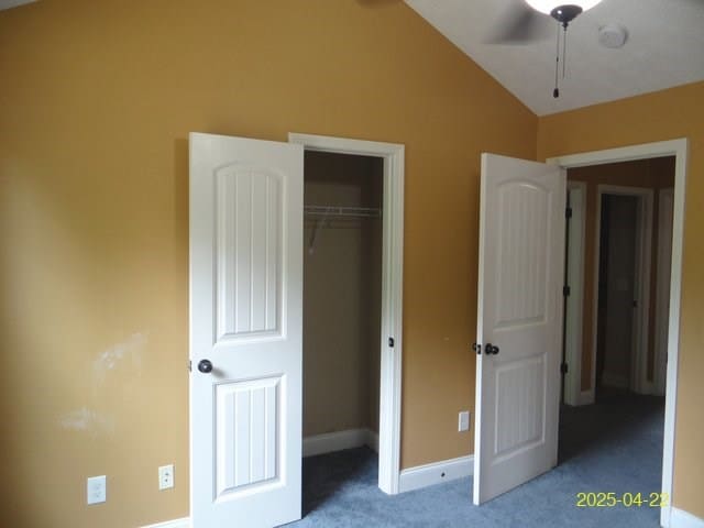 1111 Richland Dr, Columbus, GA 31907 - unfurnished bedroom with lofted ceiling, baseboards, carpet, and a closet