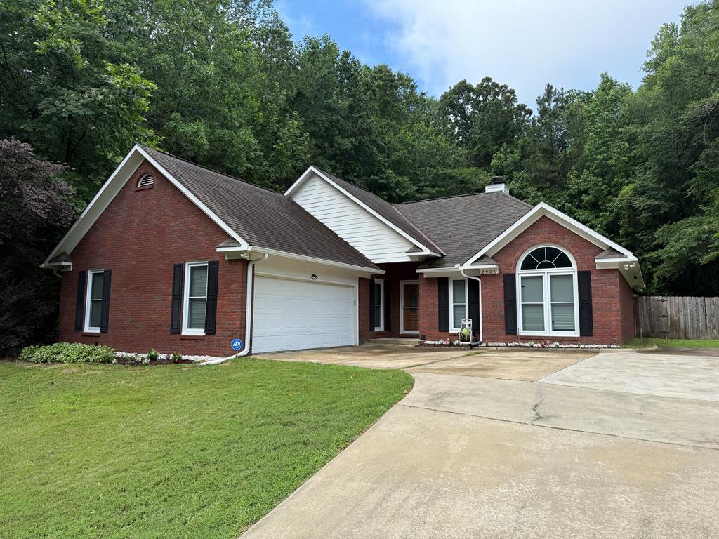 2905 10th Ave, Phenix City, AL 36867 - single story home featuring brick siding, an attached garage, concrete driveway, and a shingled roof