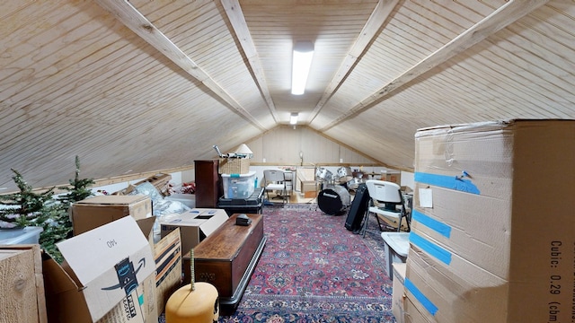 bonus room with carpet flooring and lofted ceiling with beams