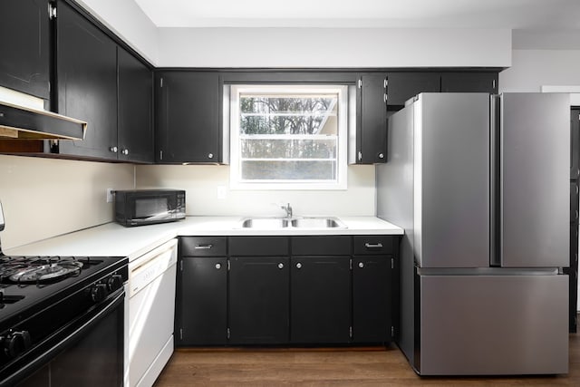 kitchen with dark hardwood / wood-style flooring, sink, and black appliances