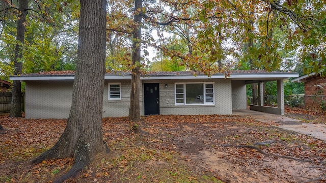 ranch-style home with a carport