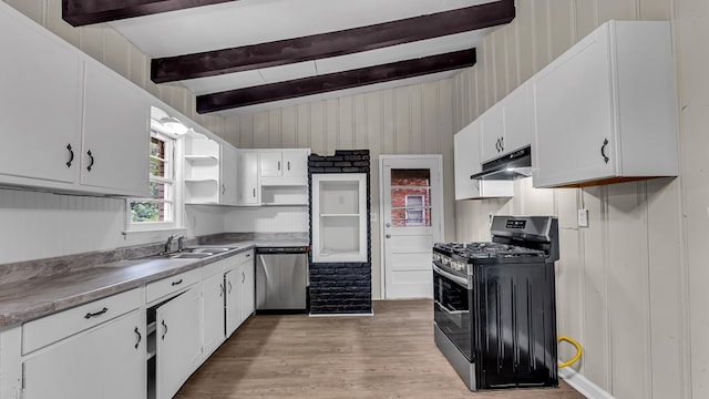 kitchen featuring light wood-type flooring, white cabinetry, sink, and appliances with stainless steel finishes